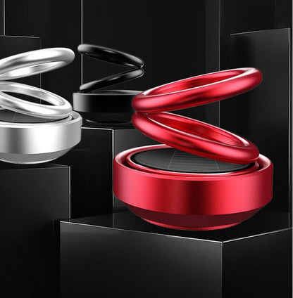 Solar-powered, rotating car air freshener with bench seat