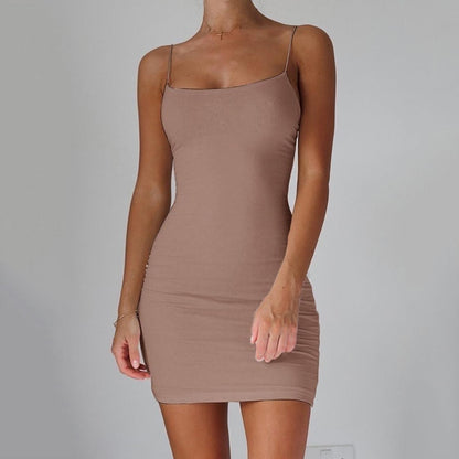Simple dress with a hanging neckline and a fitted silhouette.