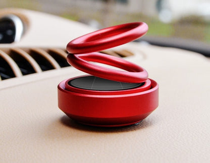 Solar-powered, rotating car air freshener with bench seat
