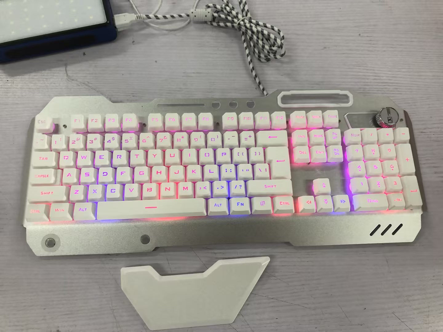 Ergonomic wired gaming keyboard with RGB backlighting and phone holder