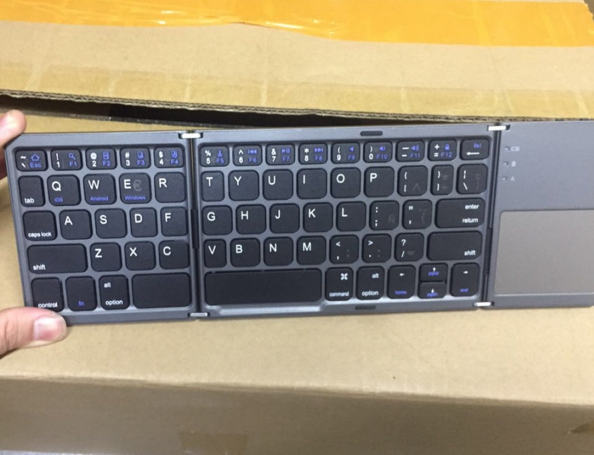 Ultra-thin, tri-fold touchscreen keyboard