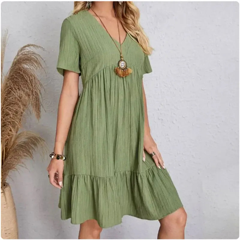 Damen Sommer Peplum Kleider Frühling V-Ausschnitt Kurzarm lockere Taille Rüschen A-Linie Urlaubs-Kleider