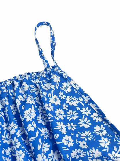 Das Cami-Kleid mit kleinen Blumenmustern rückenfreiem Design und dünnen Spaghettiträgern eignet sich für Strandurlaube und den Sommer