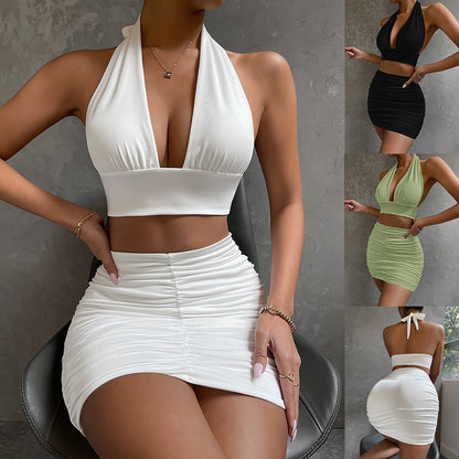 2-piece dress set: halter top with lace-up waist and pleated, hip-covering skirt